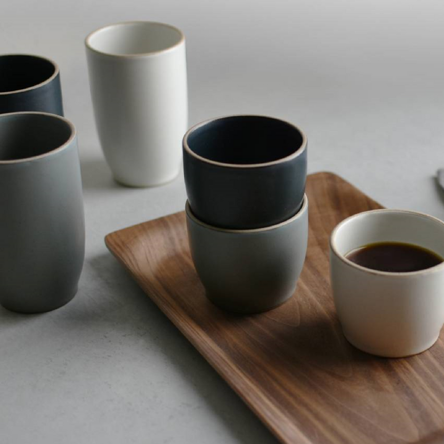 kinto cups stack up with one kinto cup full of coffee